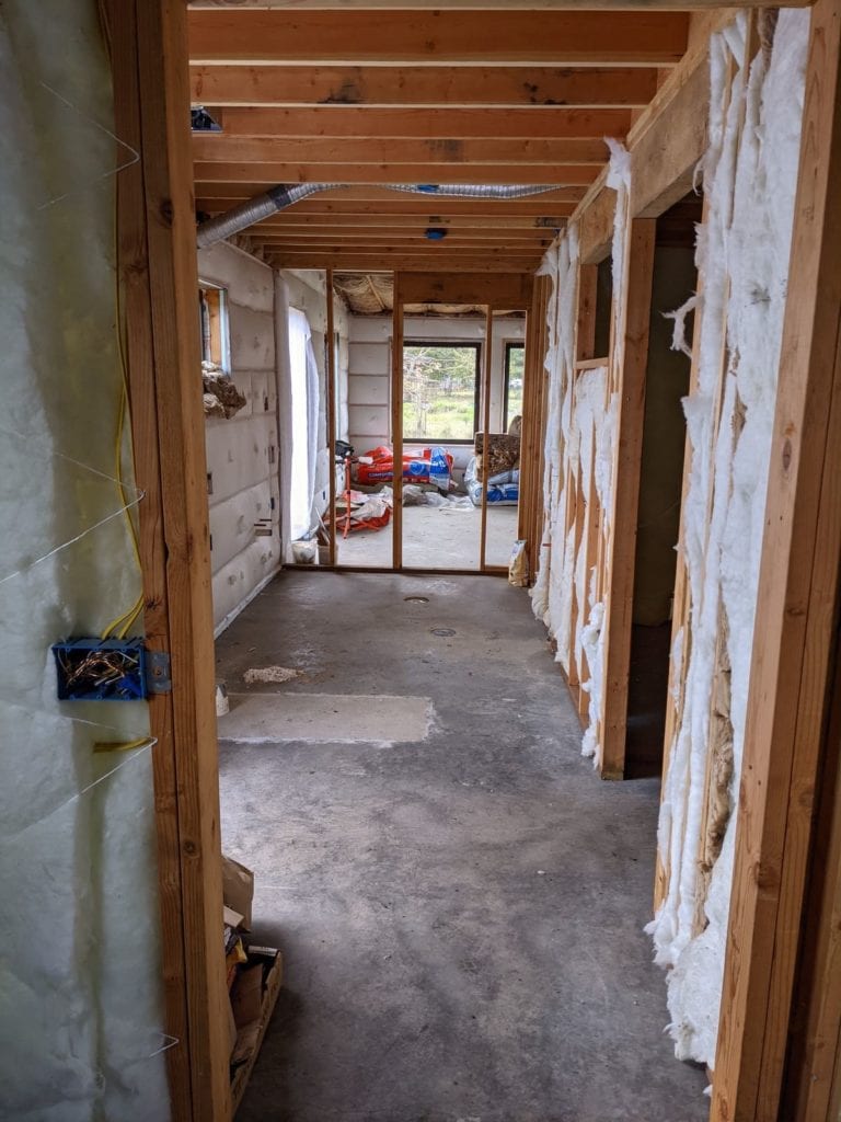 Inside building with insulation and frame showing.